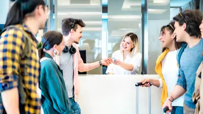 group checking into hotel