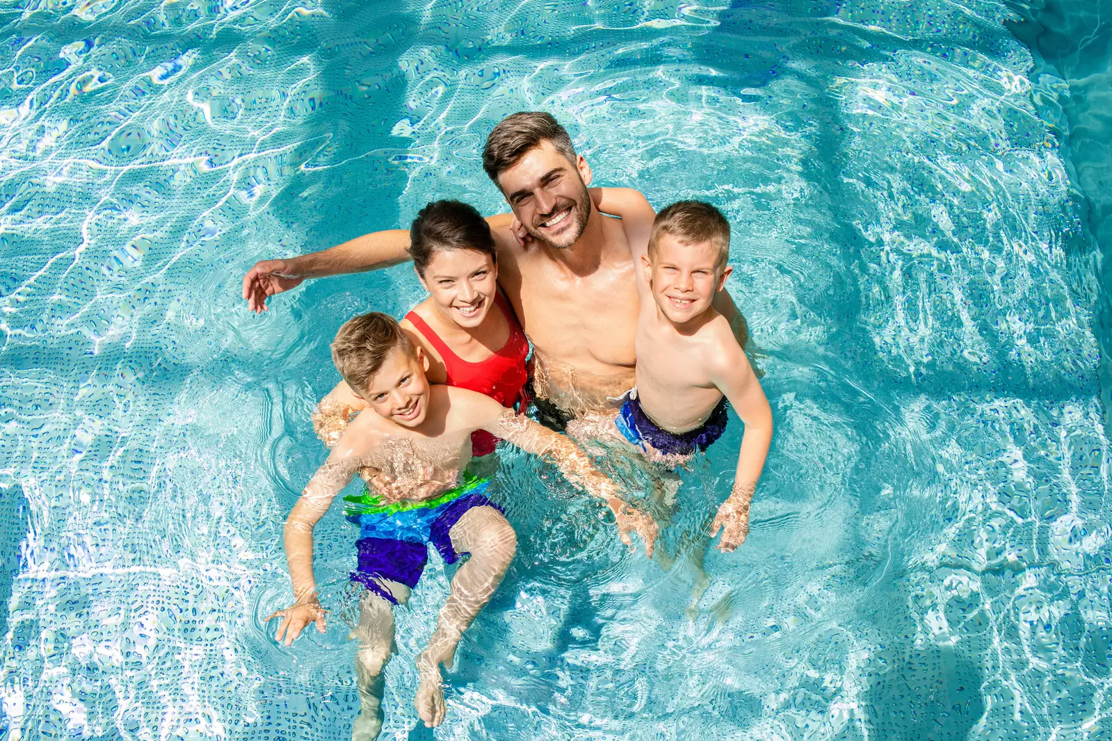 family in pool